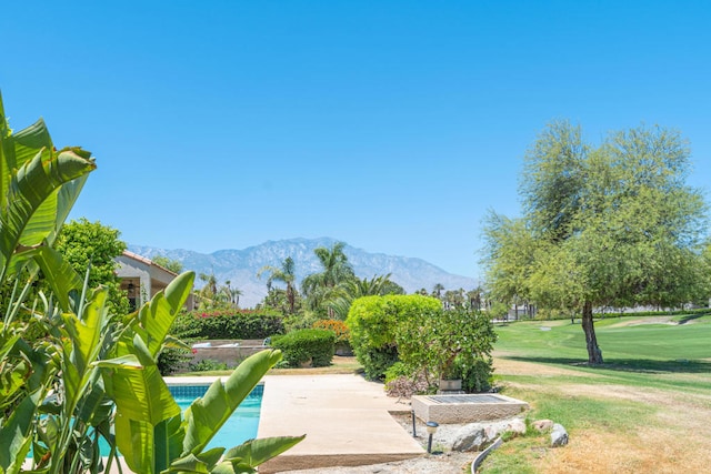 view of home's community with a mountain view and a pool