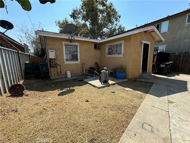 rear view of house featuring a patio area