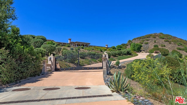 view of gate featuring a mountain view