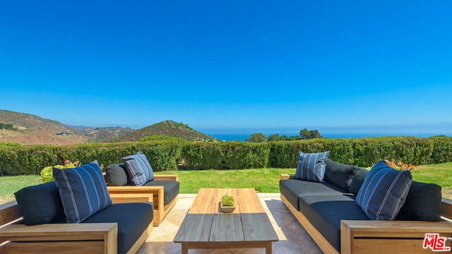 view of patio featuring a mountain view and outdoor lounge area