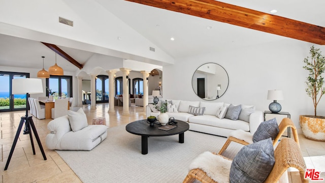 living room featuring high vaulted ceiling, beamed ceiling, and ornate columns