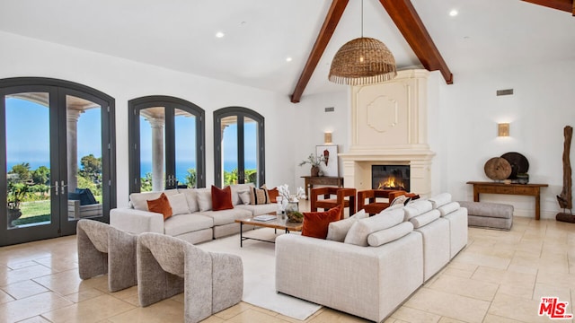 living room featuring french doors, beam ceiling, and high vaulted ceiling