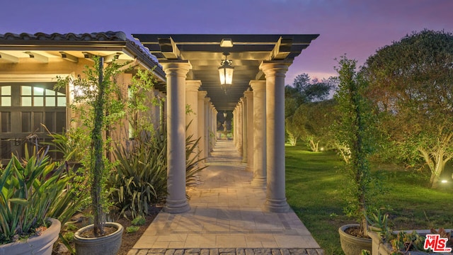 patio terrace at dusk with a lawn