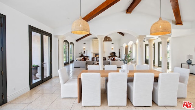 tiled dining space featuring vaulted ceiling with beams, decorative columns, and french doors