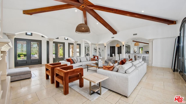 living room with high vaulted ceiling, decorative columns, beamed ceiling, and french doors