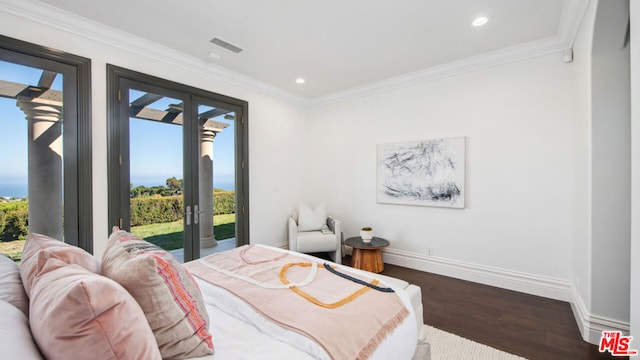 bedroom featuring ornamental molding, access to exterior, and dark hardwood / wood-style flooring