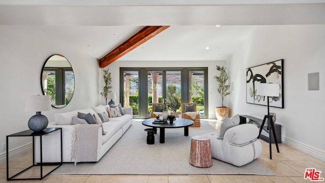 living room featuring lofted ceiling with beams, light tile patterned floors, and a healthy amount of sunlight