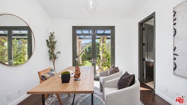 sitting room with french doors and dark hardwood / wood-style flooring