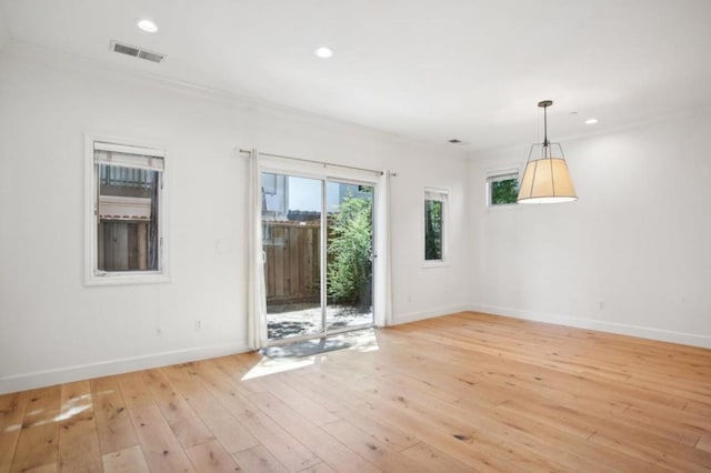 unfurnished room with light wood-type flooring