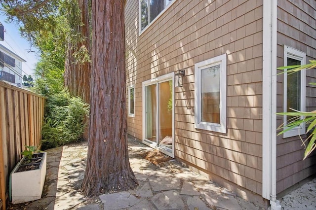 view of side of home featuring a patio