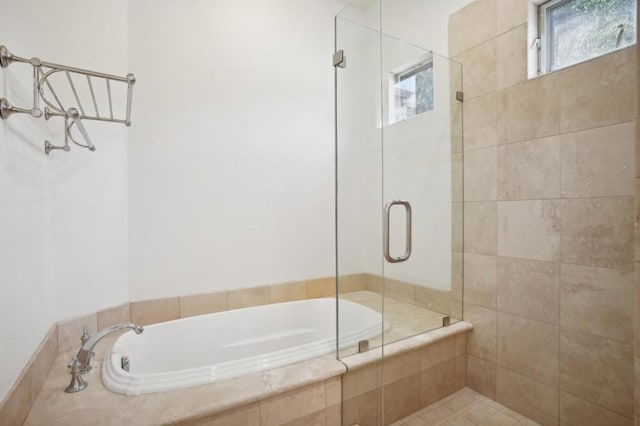 bathroom featuring plus walk in shower