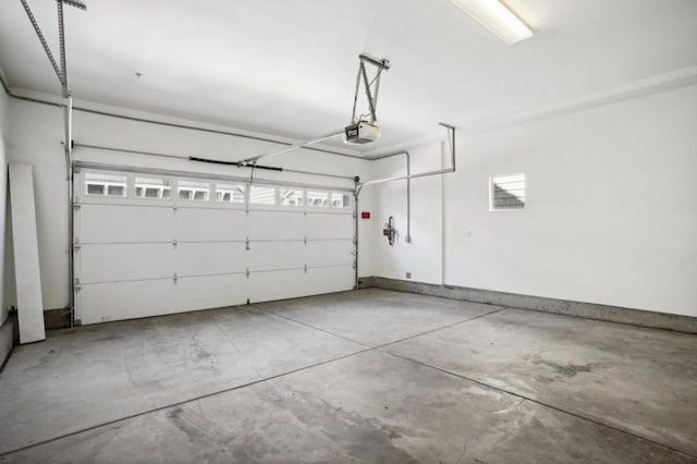 garage featuring a garage door opener