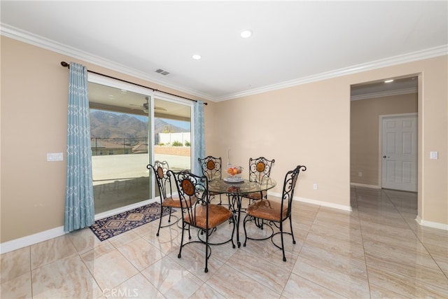 dining area with crown molding