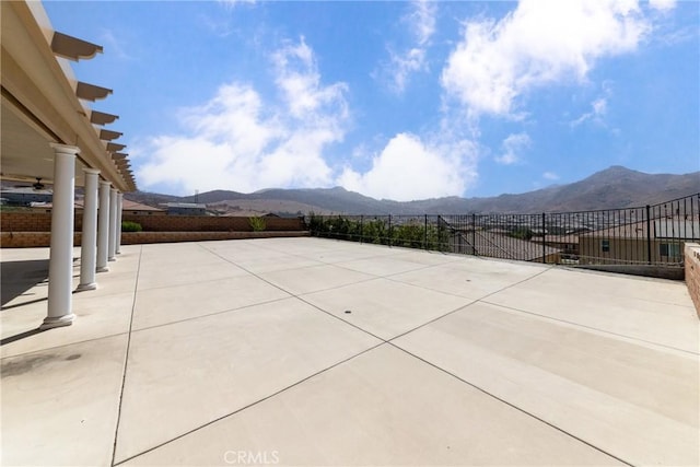 21047 Iron Rail Dr, Riverside, CA 92507 - view of patio with fence and a mountain view