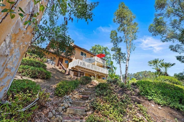 rear view of property with a deck