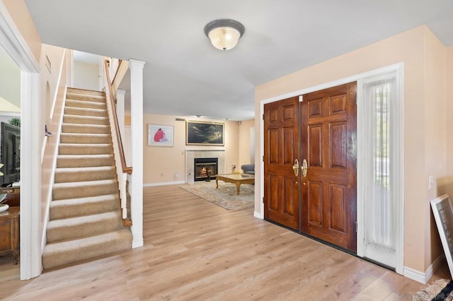 foyer entrance with light wood-type flooring