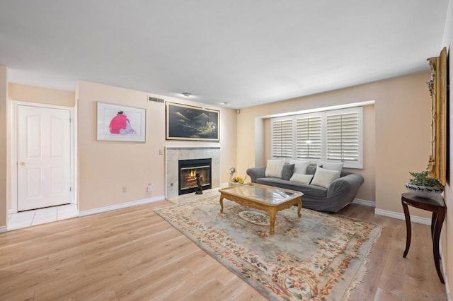 living room with light hardwood / wood-style floors