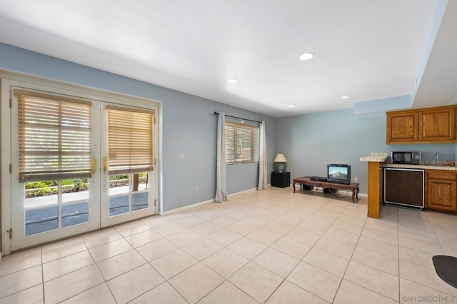 interior space featuring dishwasher and light tile patterned flooring