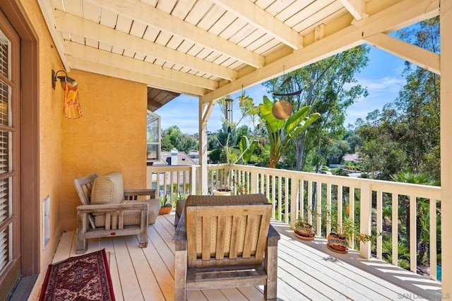 wooden terrace with outdoor lounge area