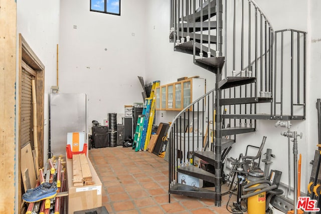 staircase with tile patterned flooring