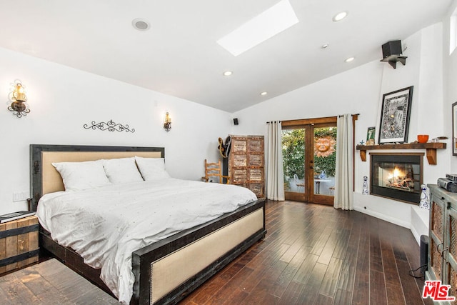 bedroom with french doors, dark hardwood / wood-style flooring, access to outside, and lofted ceiling with skylight