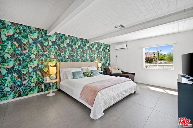 bedroom featuring beamed ceiling, a wall mounted air conditioner, and tile patterned floors