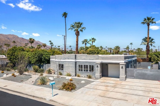 view of front of home featuring a mountain view