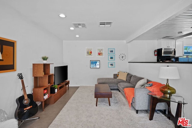 living room with beamed ceiling