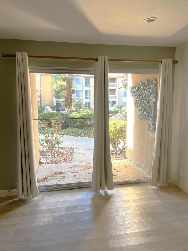 doorway to outside featuring light hardwood / wood-style floors