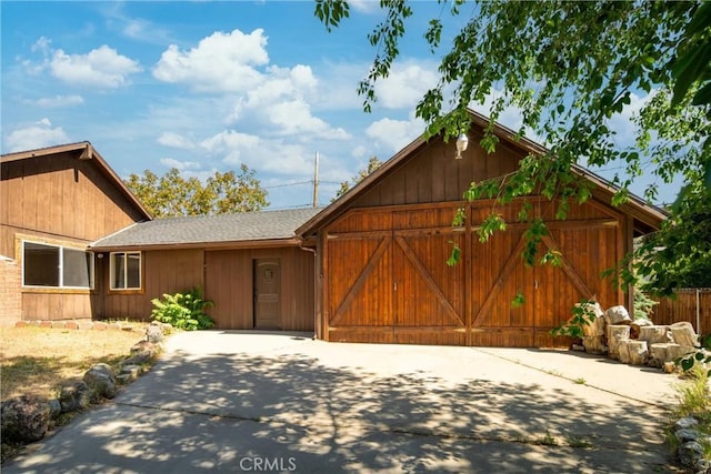 4225 Alcot Trl, Frazier Park, CA 93225 - view of front of house featuring concrete driveway, a shingled roof, and a garage