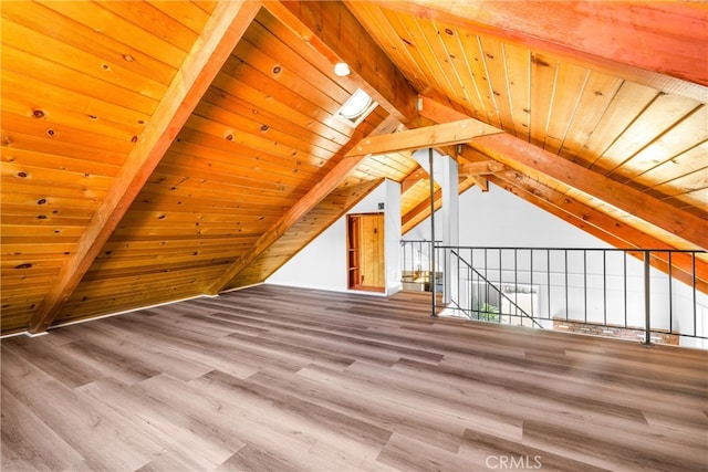 bonus room featuring wood ceiling, hardwood / wood-style floors, and vaulted ceiling with beams