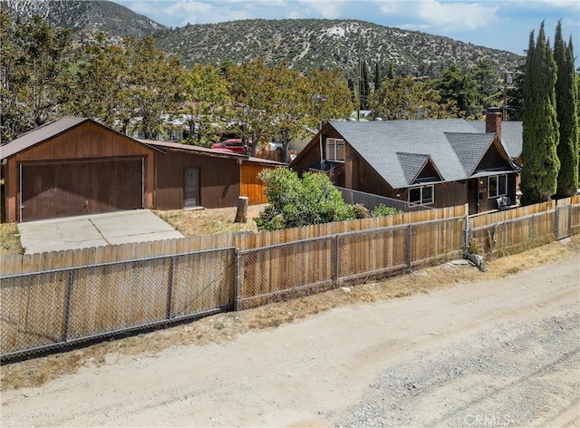 view of front of home featuring a garage and a mountain view