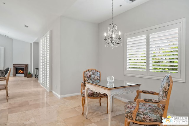 dining area with an inviting chandelier