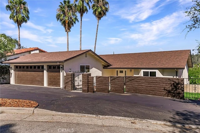 ranch-style home featuring a garage