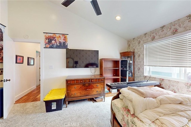 bedroom with high vaulted ceiling, light carpet, and ceiling fan