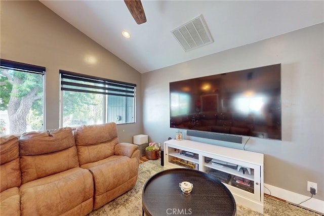 living room featuring vaulted ceiling and ceiling fan