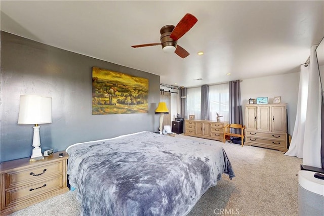 carpeted bedroom featuring ceiling fan