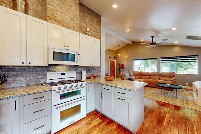 kitchen featuring white cabinetry, backsplash, light hardwood / wood-style floors, kitchen peninsula, and white appliances