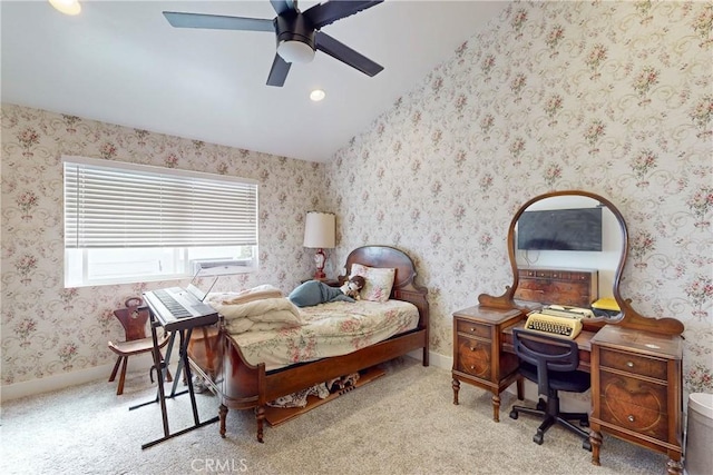 bedroom featuring light carpet, vaulted ceiling, and ceiling fan