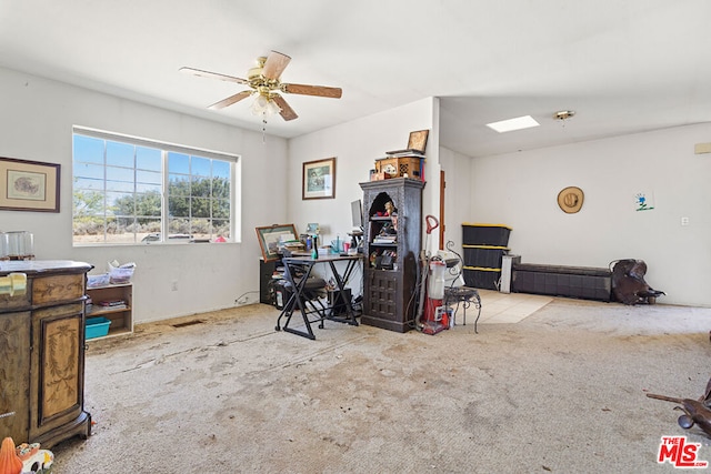 miscellaneous room featuring light carpet and ceiling fan