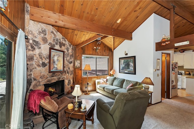 carpeted living room featuring wooden ceiling, a fireplace, beamed ceiling, and high vaulted ceiling