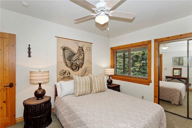 bedroom with ceiling fan and carpet floors