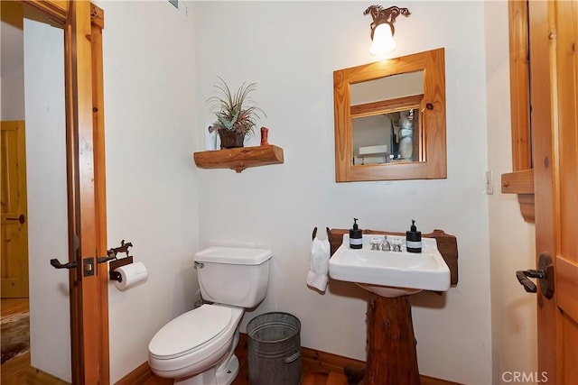 bathroom with sink and toilet