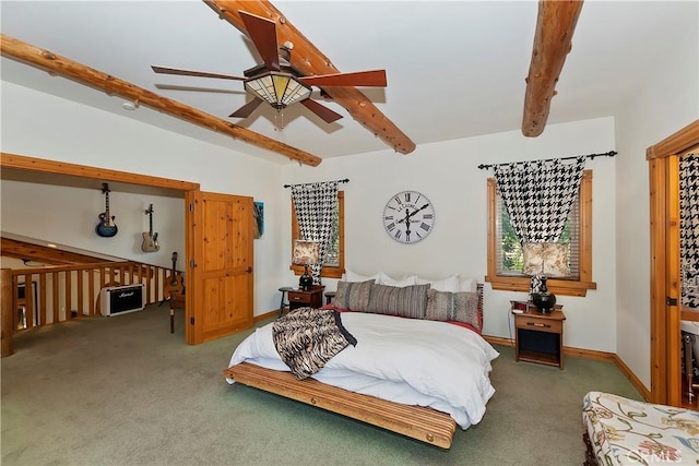 carpeted bedroom with ceiling fan and beam ceiling