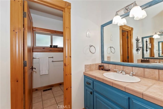 bathroom featuring tile patterned floors and vanity