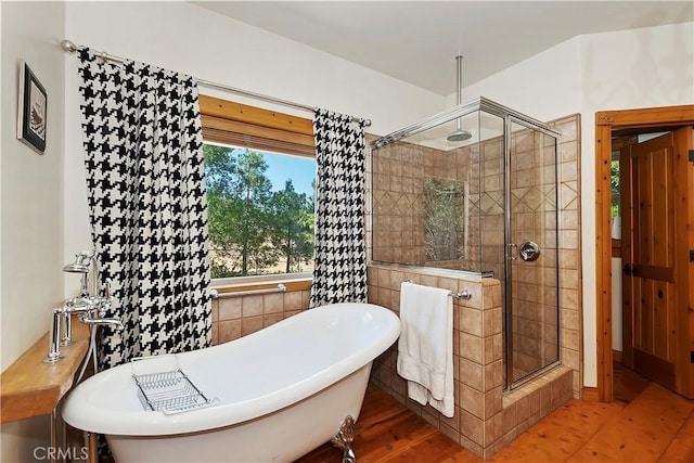 bathroom with wood-type flooring and plus walk in shower