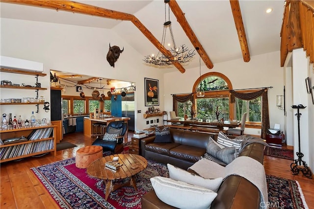 living room featuring high vaulted ceiling, beam ceiling, dark hardwood / wood-style floors, and an inviting chandelier