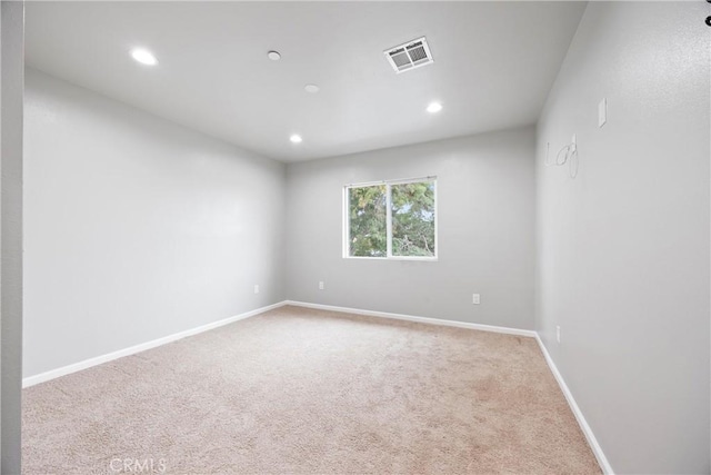 empty room featuring carpet floors