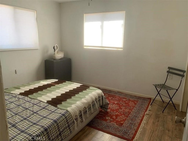 bedroom with wood-type flooring