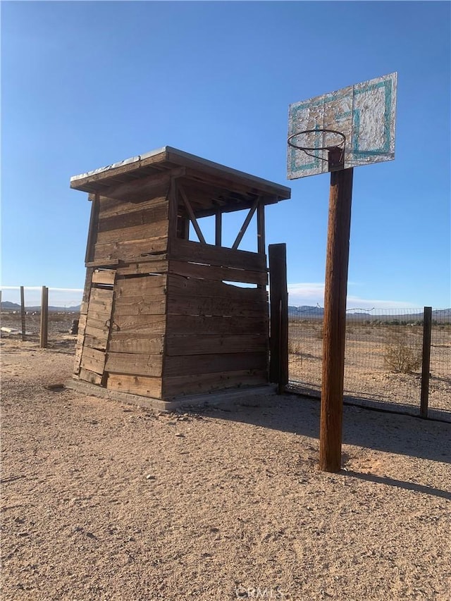 view of outbuilding featuring a rural view